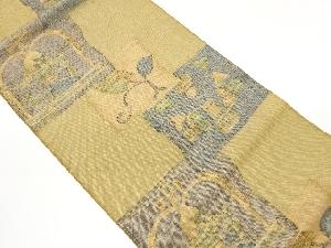 手織り紬色紙にエジプト人物・草花模様織出し名古屋帯